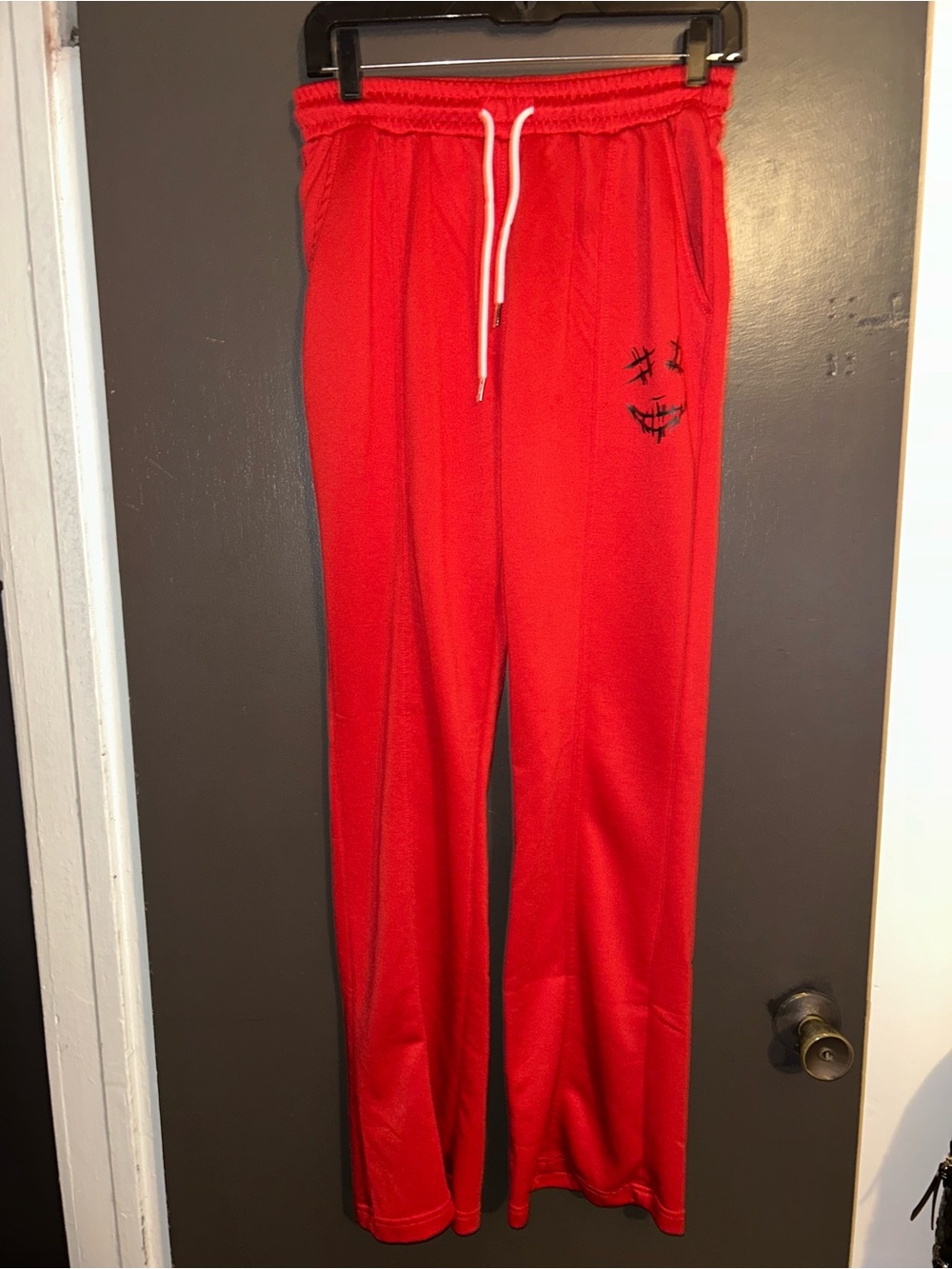 Mens Red Jogger Pants with Smiley Stitch Detail